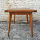 Oak table has two vintage extensions