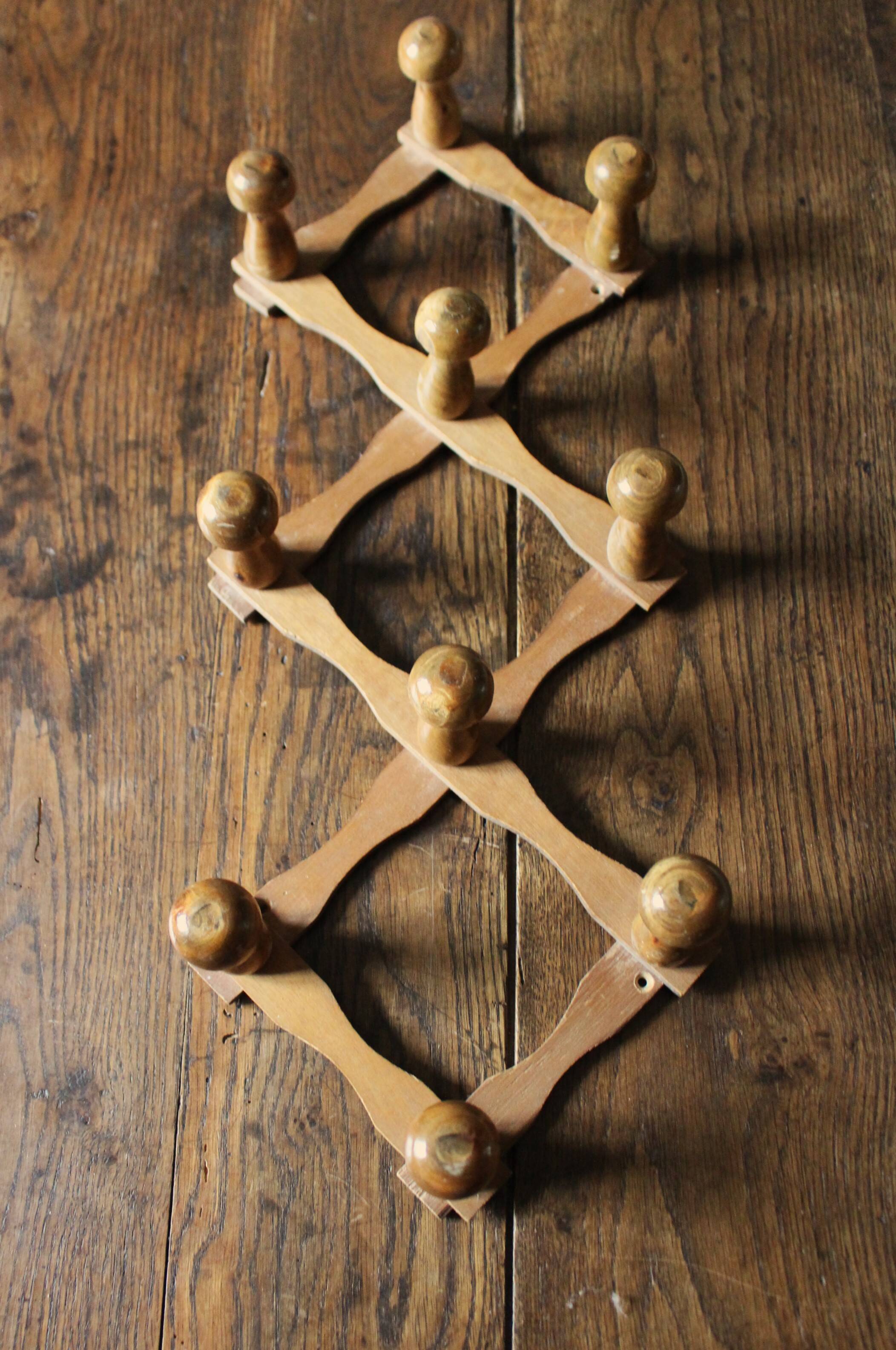 Vintage wooden ball accordion coat rack