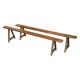 Pair of antique Victorian trestle benches in fruitwood.