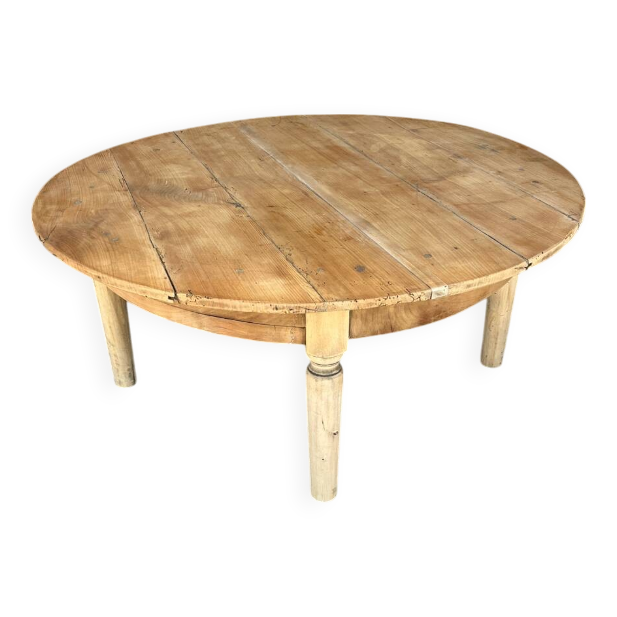 Round coffee table in raw wood
