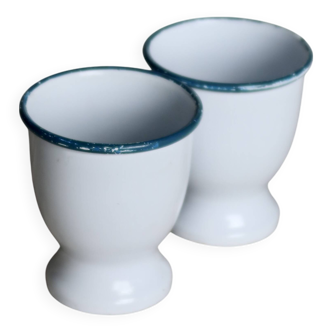 Vintage egg cups in white enamelled sheet metal with blue-green edging