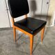 Set of 4 vintage 1960s chairs in wood and black faux leather – design