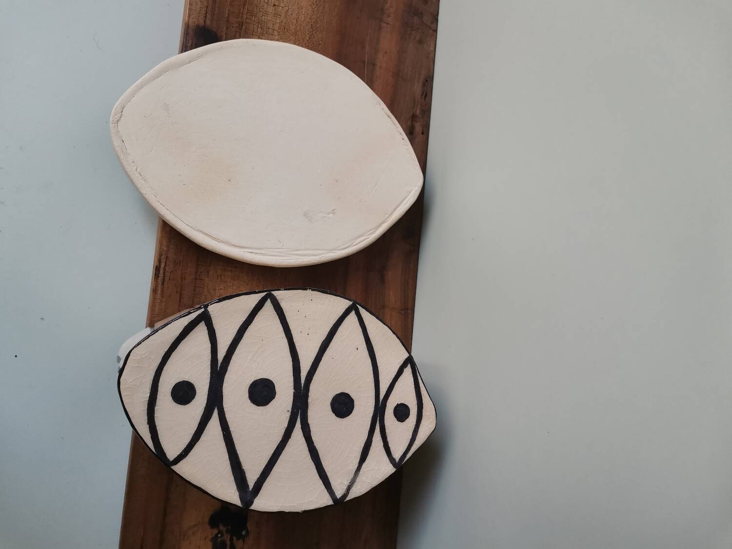 Vintage artisanal rustic ceramic butter dish with geometric eye pattern