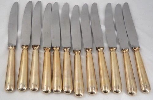 12 table knives model Baguette, golden handles, excellent condition.