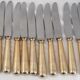 12 table knives model Baguette, golden handles, excellent condition.