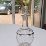 Blown glass decanter, engraved and chiselled. Made in France.