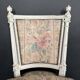 Antique Louis XVI style chair with patinated wood and floral fabric.