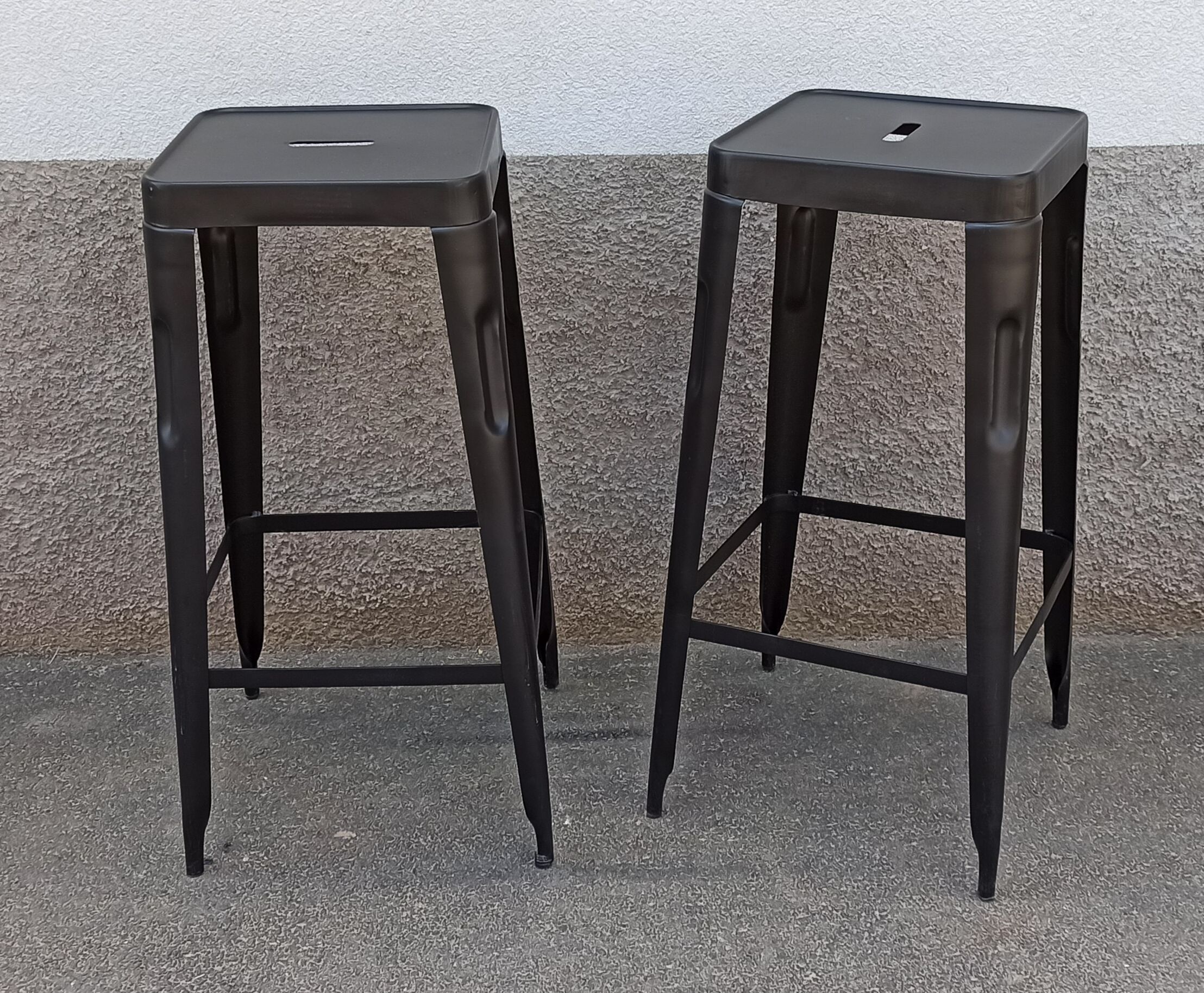 Pair of black metal stools