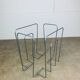 Postmodern magazine rack in grey metal, 1980s.