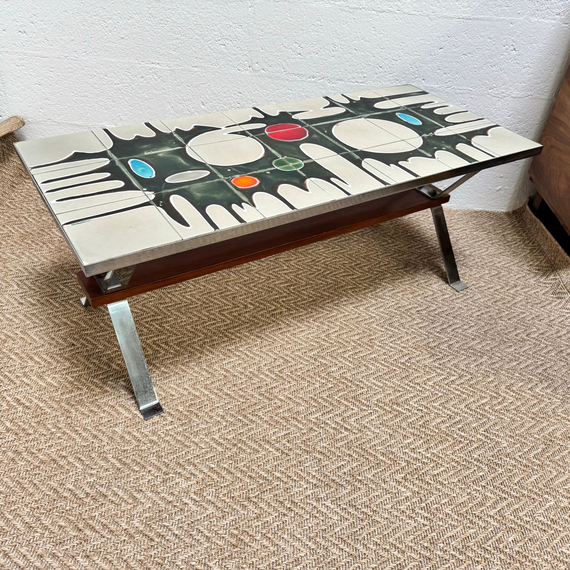 Vintage coffee table from the 60s and 70s in ceramic, chrome metal, and wood.