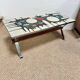 Vintage coffee table from the 60s and 70s in ceramic, chrome metal, and wood.