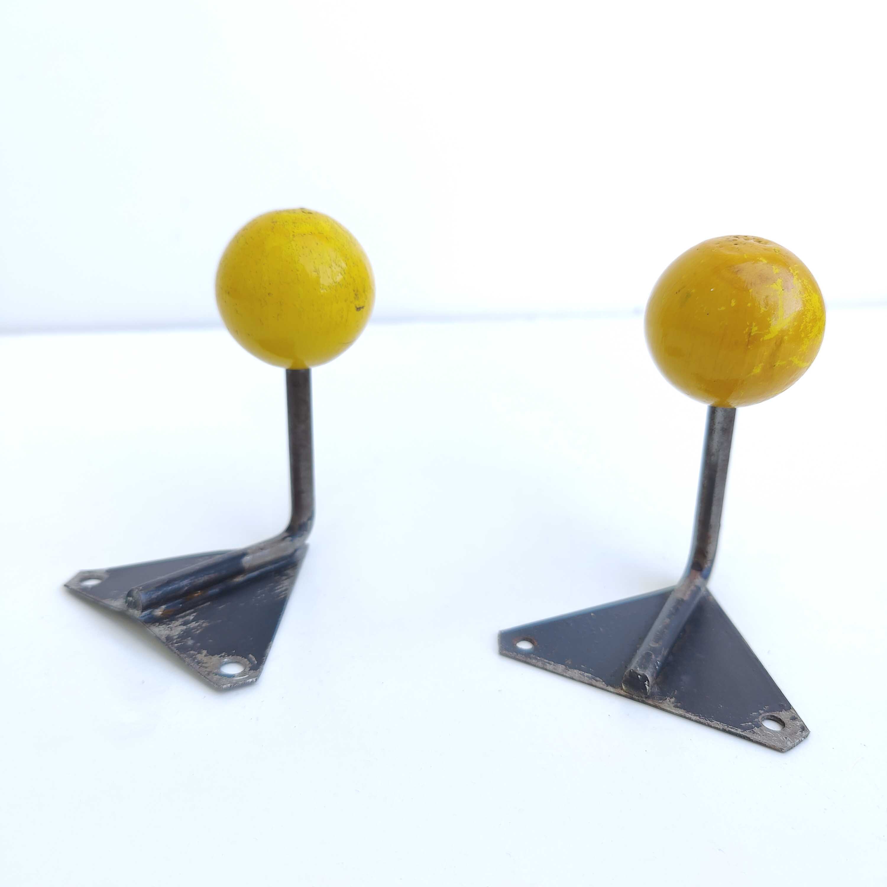 Two coat racks hooks balls yellow wood