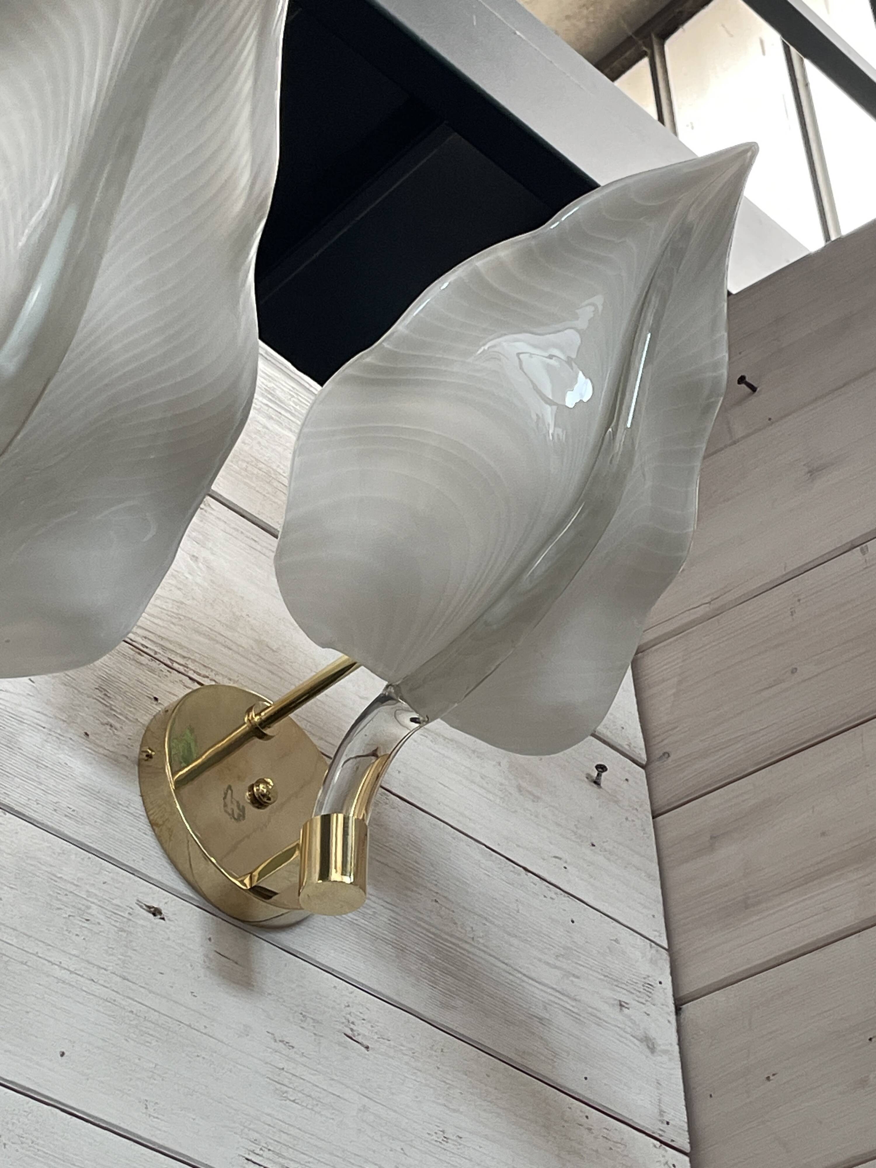 Set of 3 Murano glass wall lamps in white and brass, 1970s.