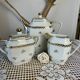 Three-piece tea or coffee service in Limoges porcelain by Singer, years.