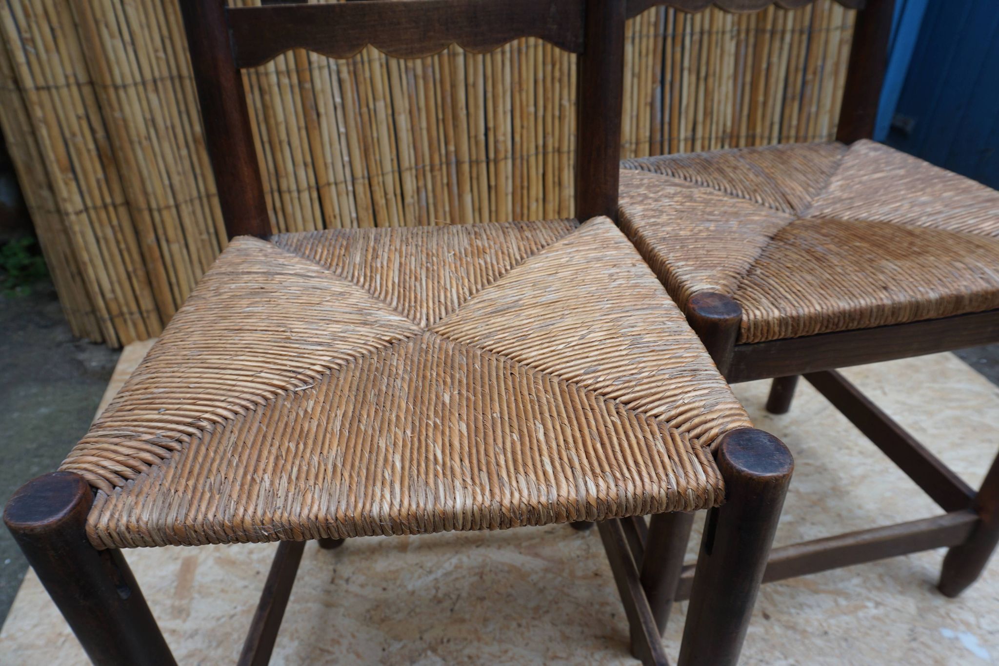 Pair of antique straw-seated farm chairs