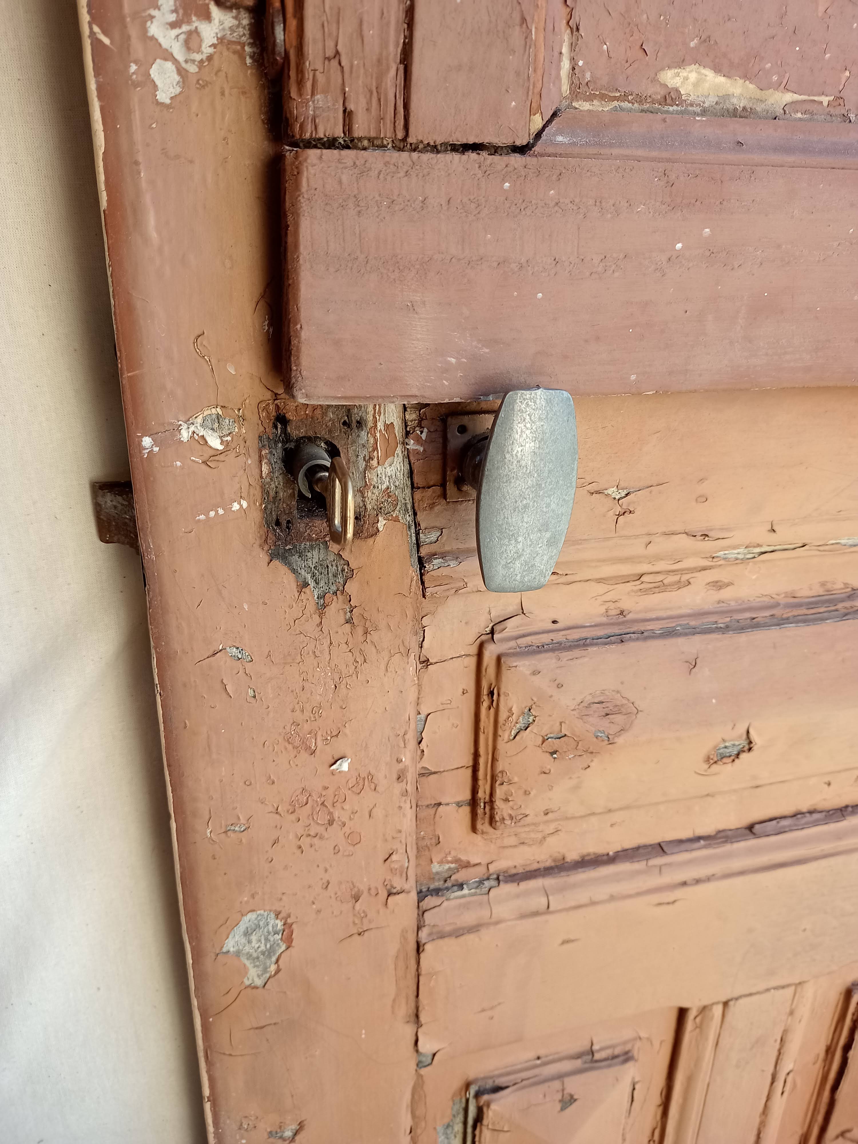 Old glazed door with its shutter