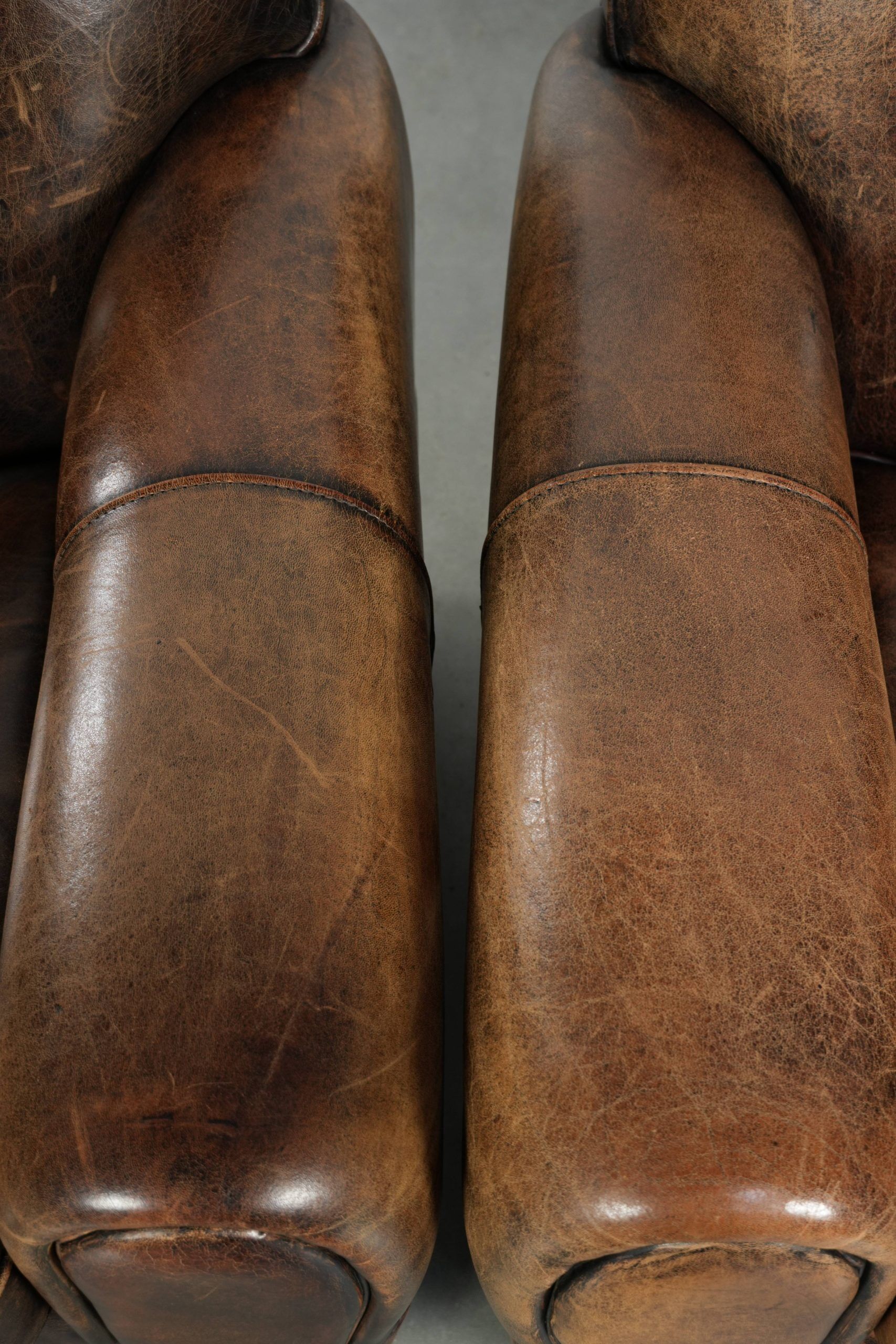 Set of two sheepskin Art Deco design armchairs with beautiful patina