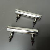 Two chrome drawer handles