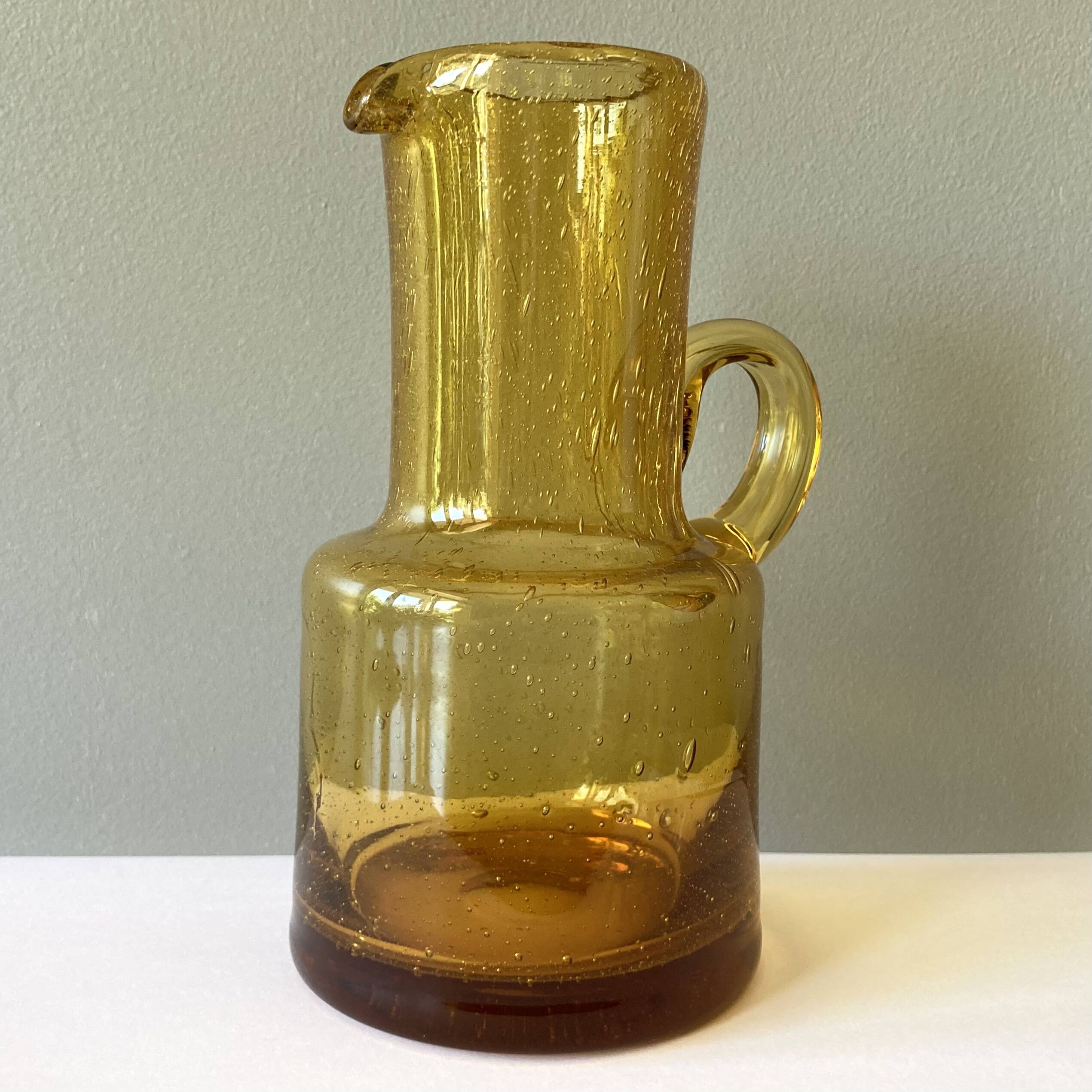 Vintage pitcher or jug forming a vase in amber and bubbled glass in the style of Biot glassware