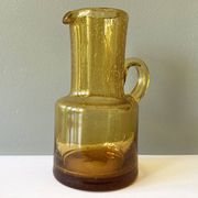 Vintage pitcher or jug forming a vase in amber and bubbled glass in the style of Biot glassware