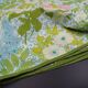 Nappe ronde à décor de fleurs vers 1970