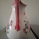 Old ceramic pitcher with floral decoration.