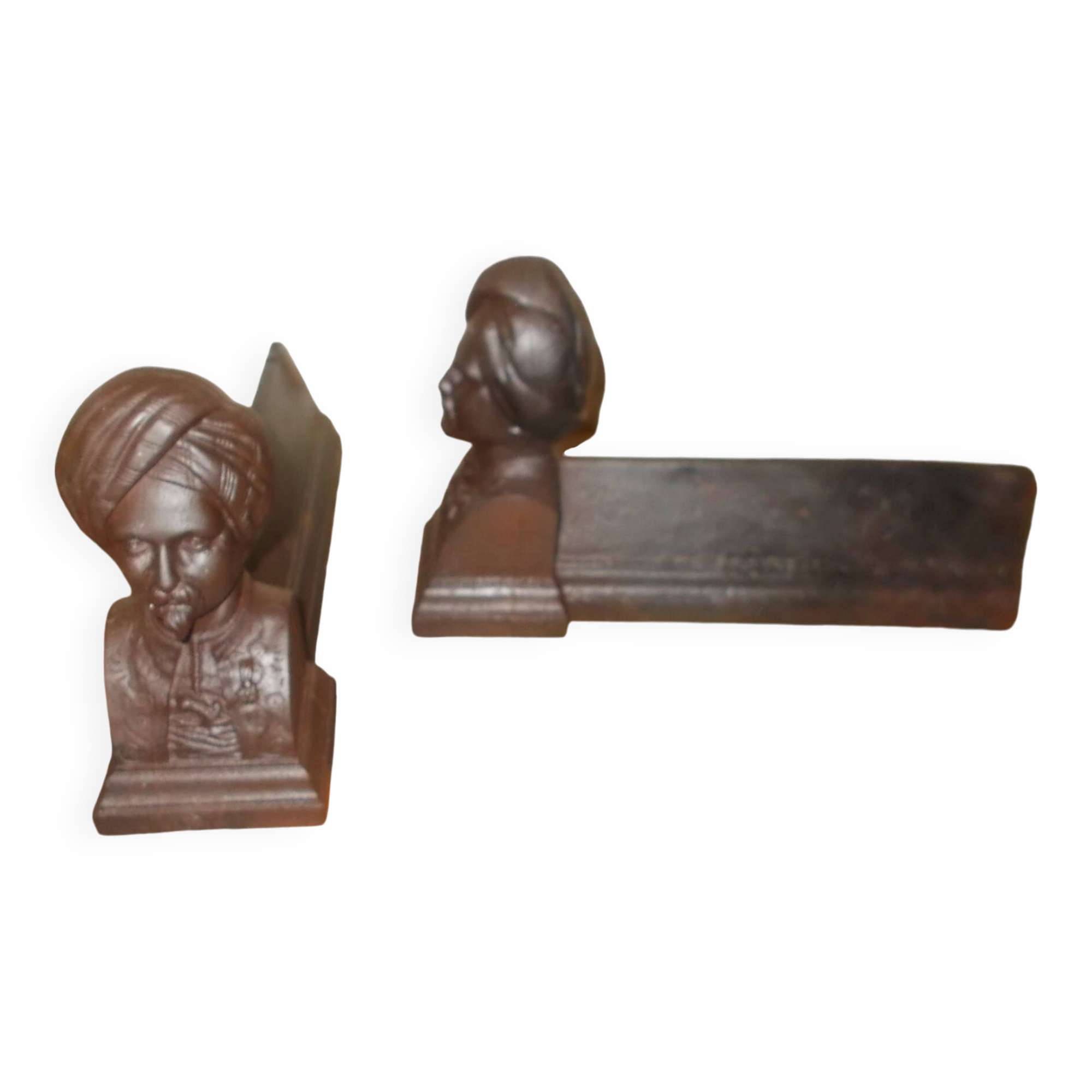 Old cast iron andirons with oriental decor