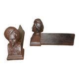 Old cast iron andirons with oriental decor