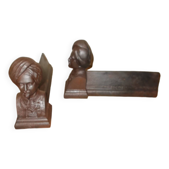 Old cast iron andirons with oriental decor