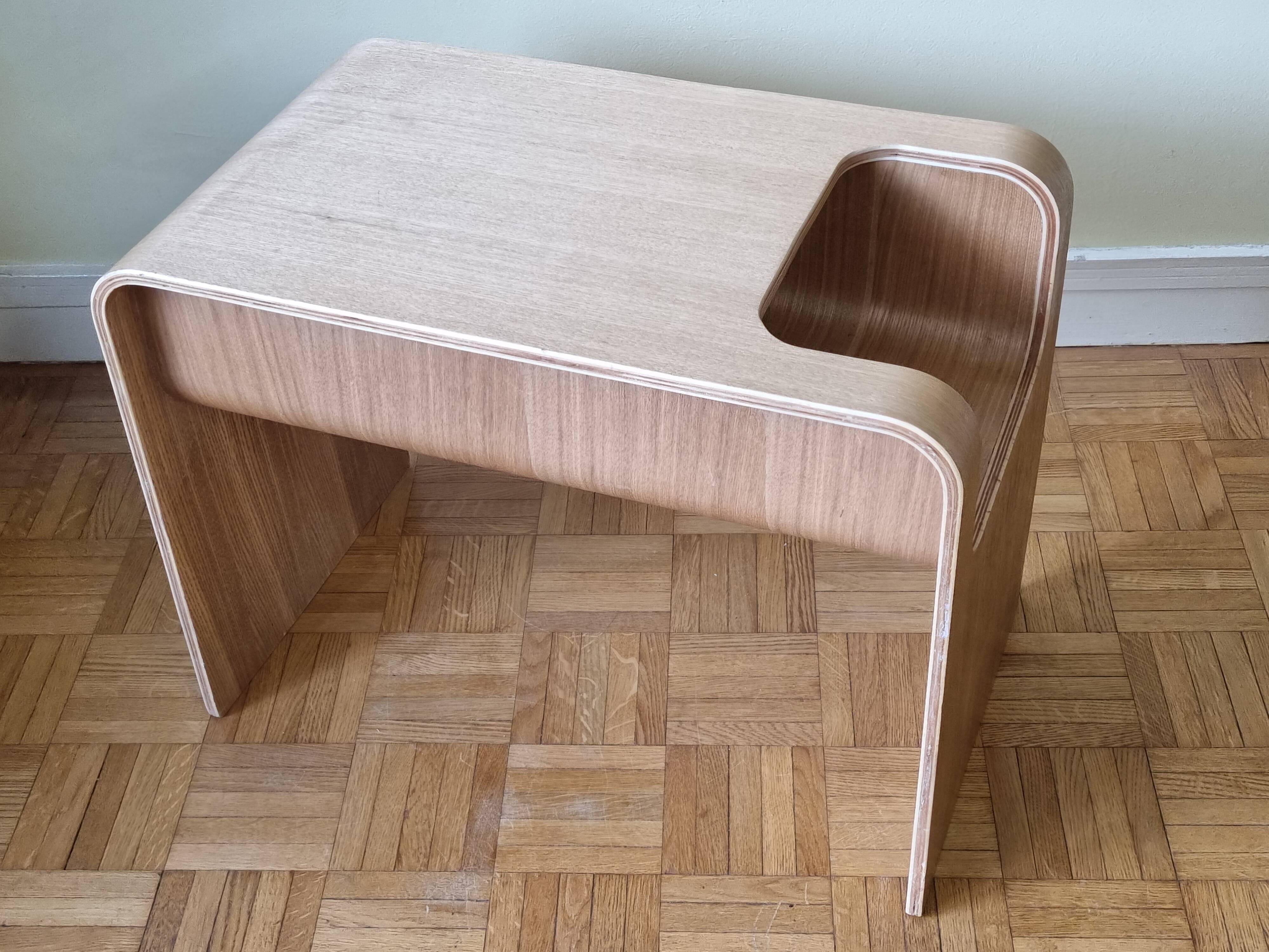 Boone coffee table in curved wood produced by Habitat, design