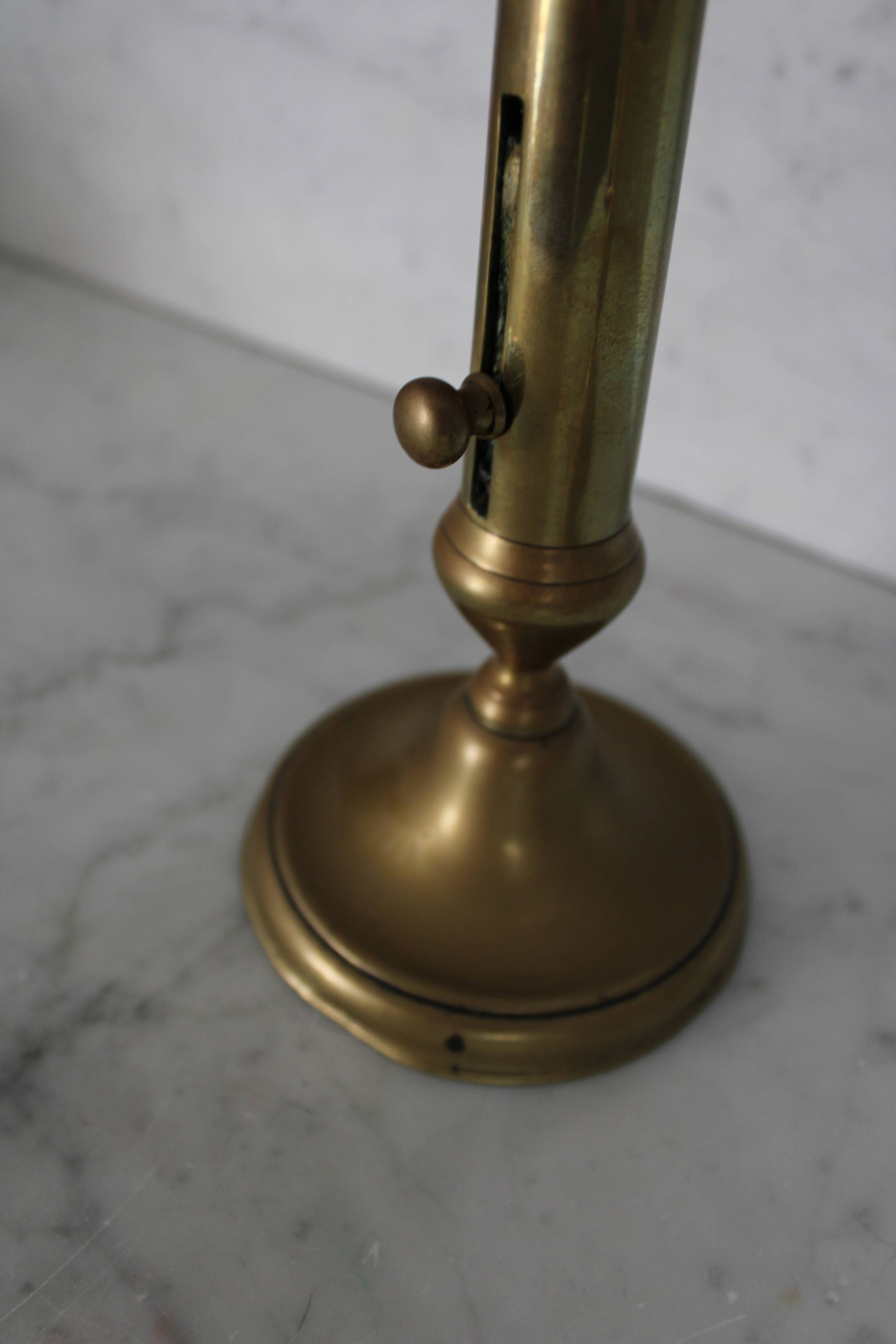 Pair of brass pusher candlesticks