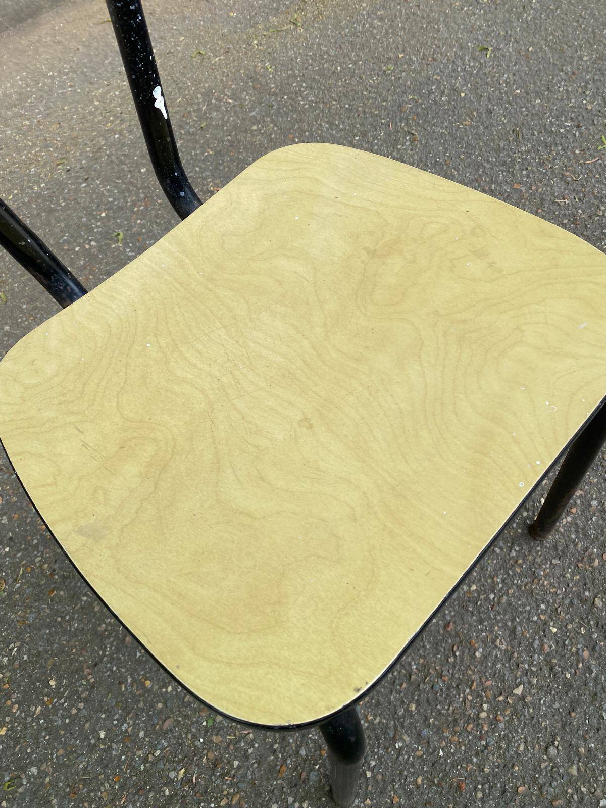 Yellow formica and black steel chair from the 1970s.