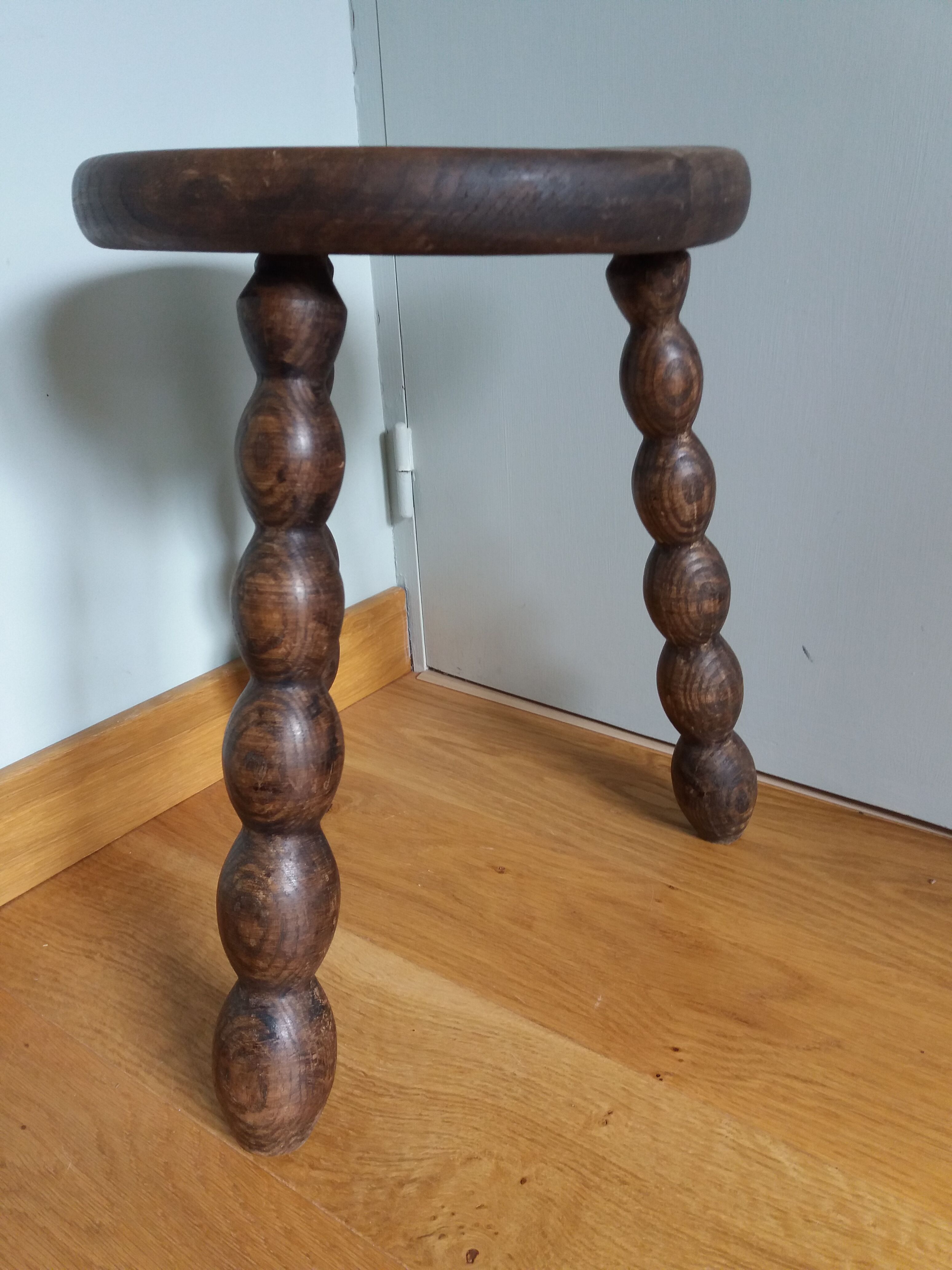 Tripod stool in wood turned coil way