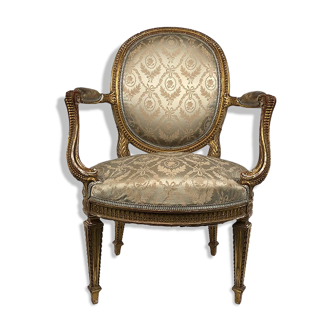 Carved and gilded wooden armchair in Louis XVI style, circa 1900