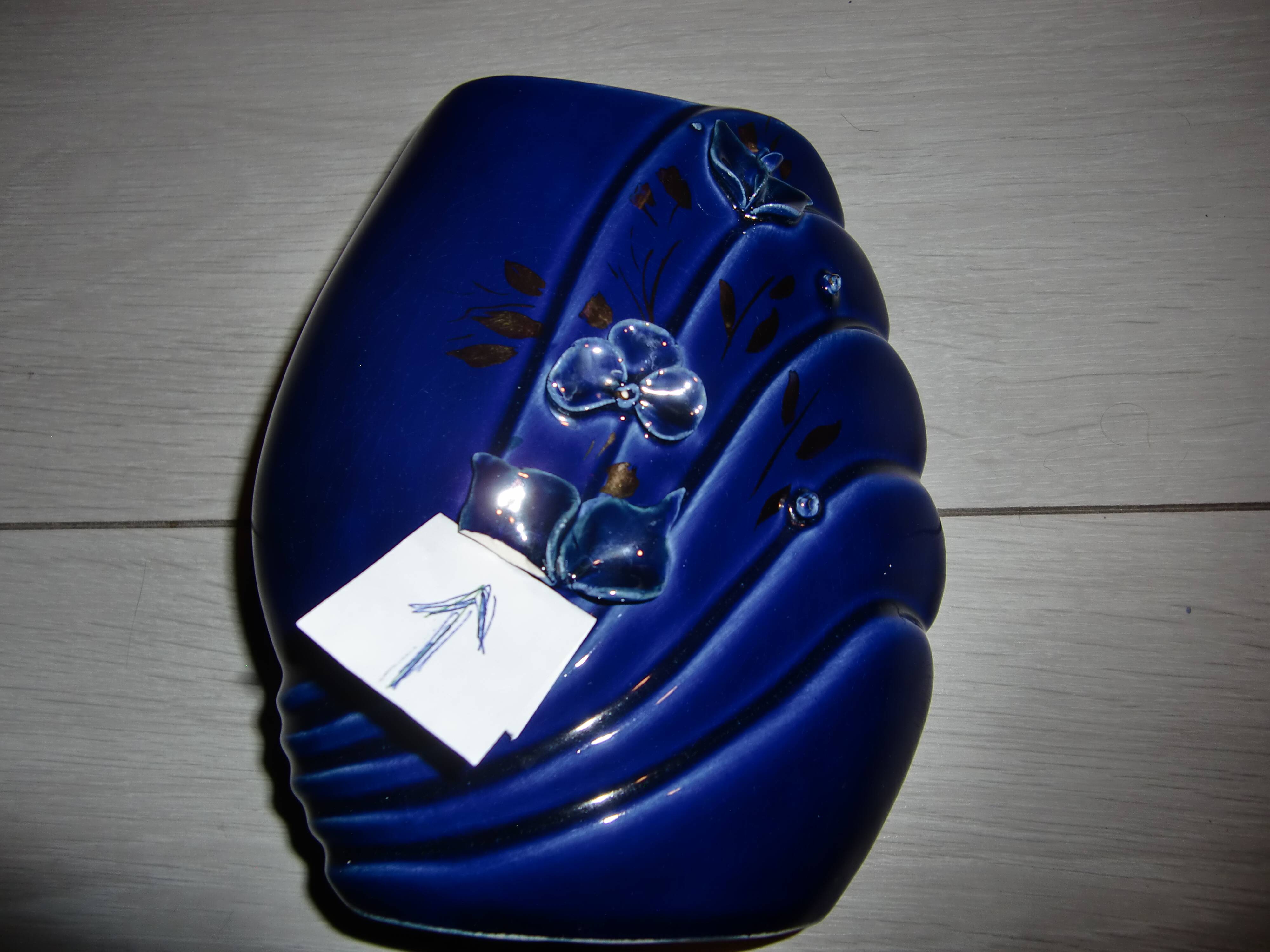 Blue lacquered vase with flowers & applied leaves