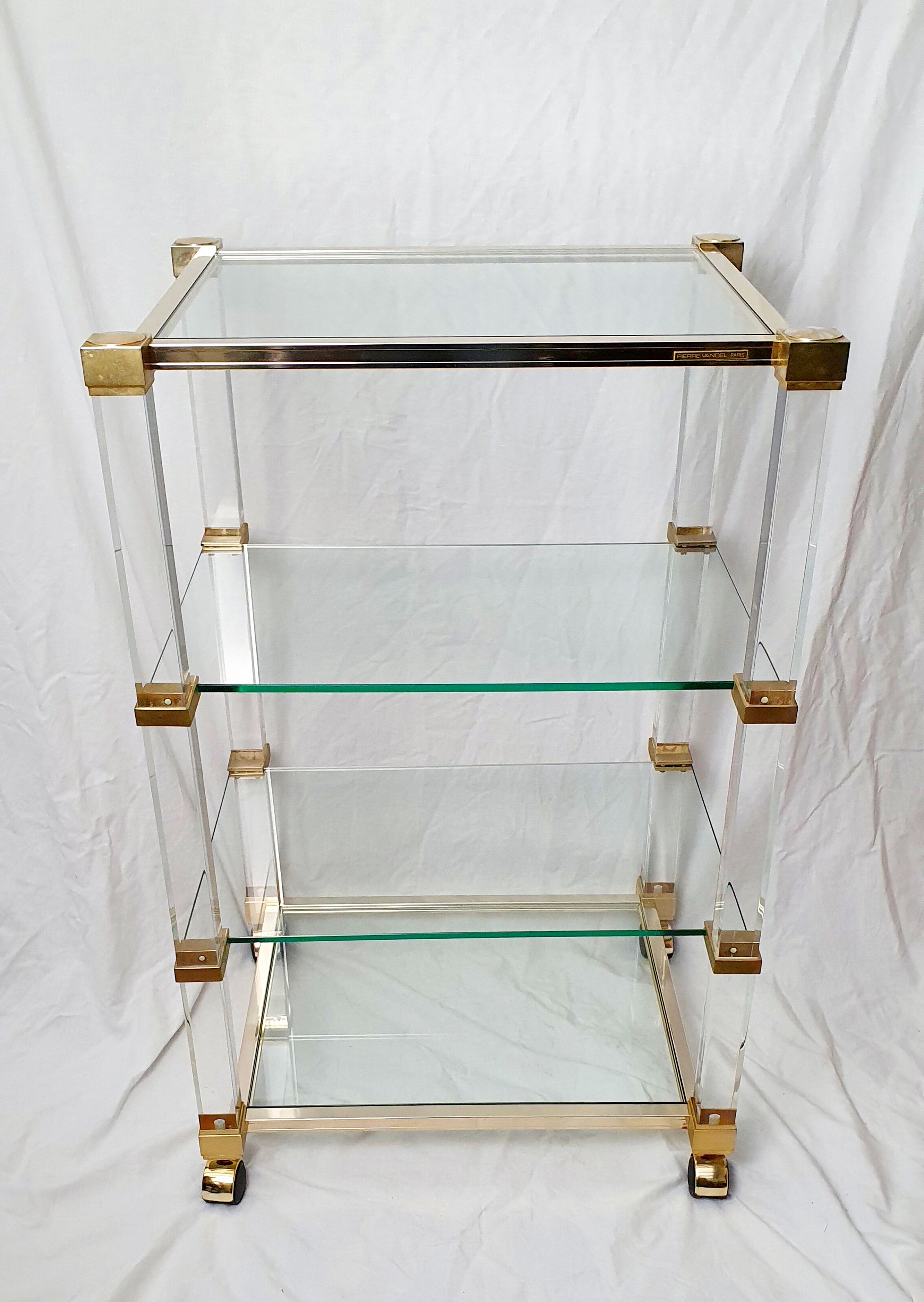 Rolling glass and plexiglass shelf by Pierre Vandel