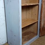 Rustic antique bonnetière in weathered blue-grey wood.