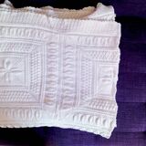 Knitted white cotton bedspread