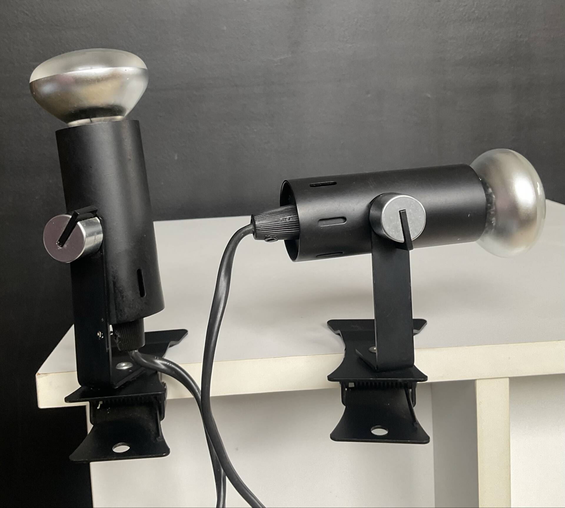 A pair of clamp lamps from the 1970s.