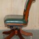 Modern captain's chair in leather, beech frame, adjustable.