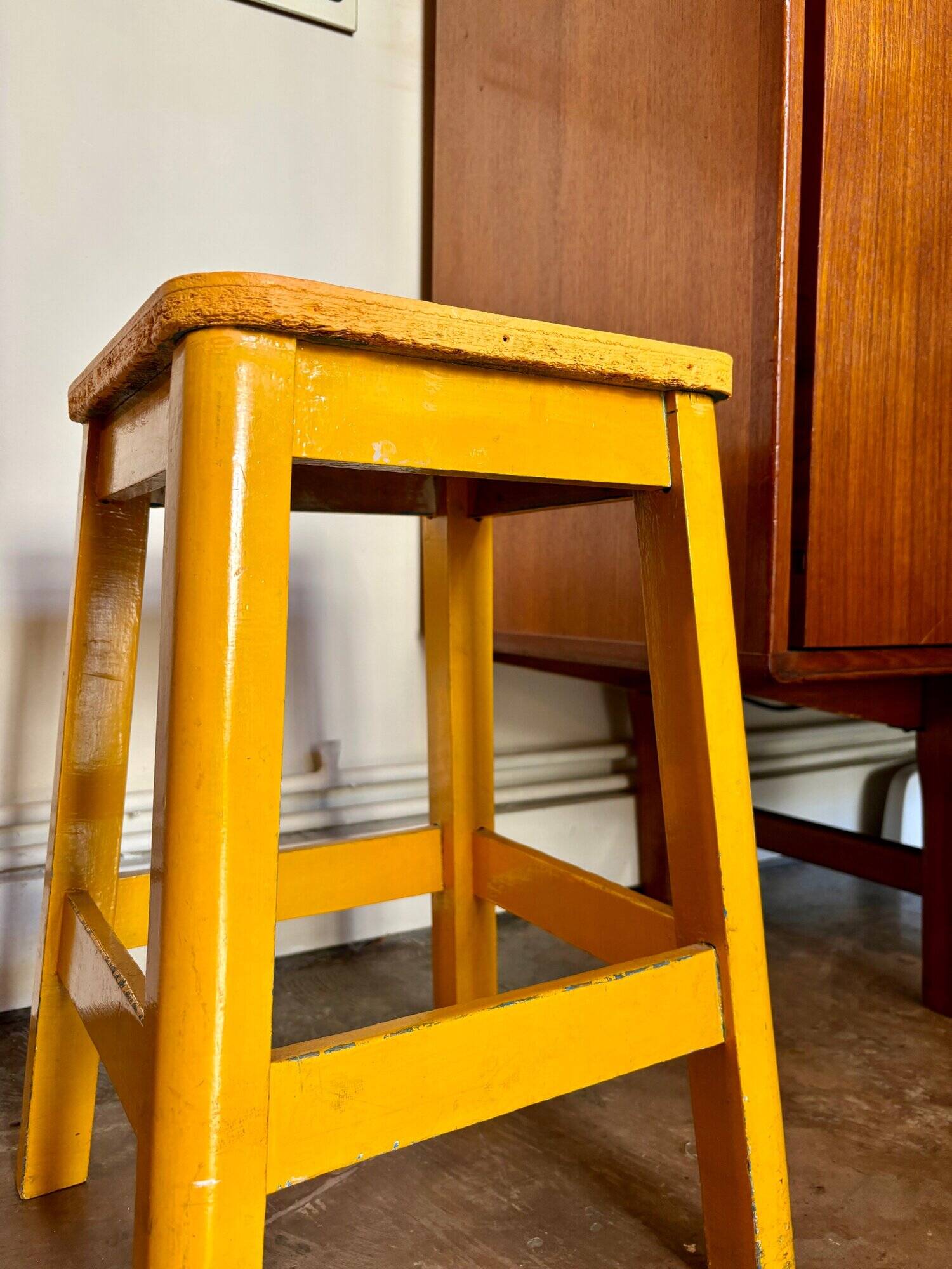 Yellow wooden stool