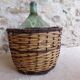 Dame-jeanne in her basket