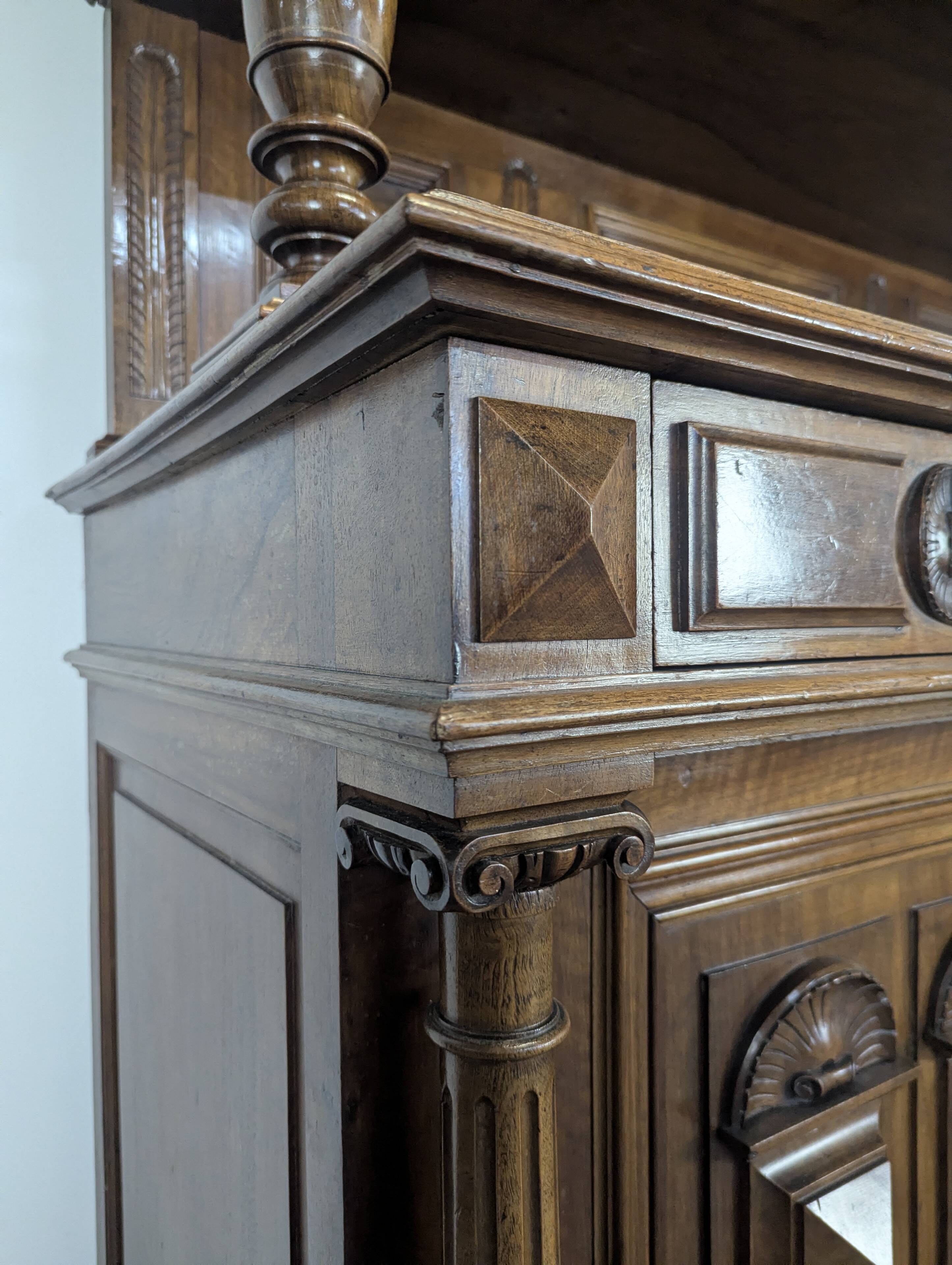 Large buffet with 2 bodies in Renaissance style made of solid walnut.
