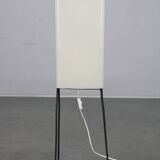 Mid-century modern floor lamp on iron legs with plastic shade and wood accent