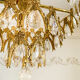 Vintage chandelier in gilded brass with crystal pendants.