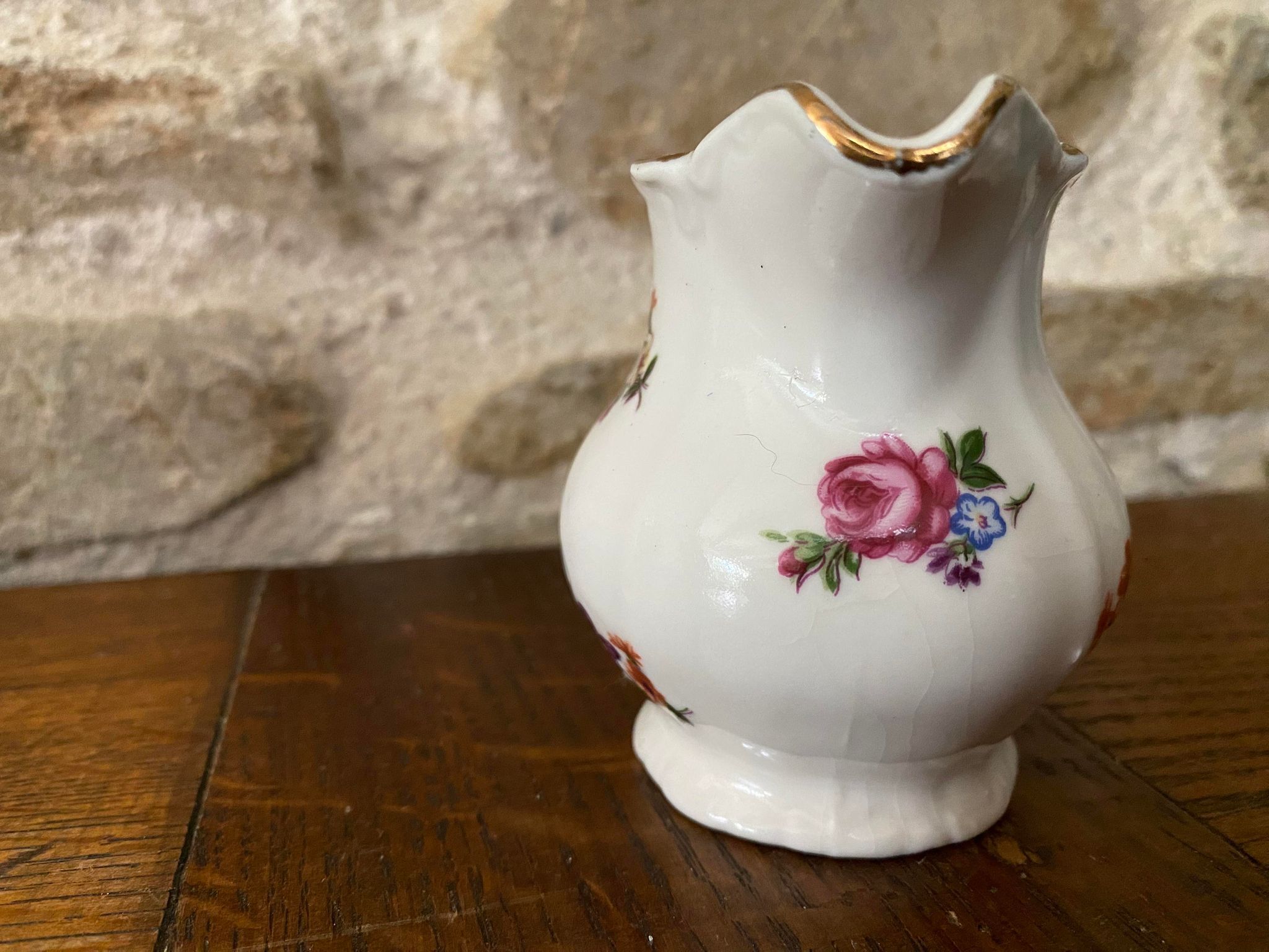 Small milk jug or creamer decoration flowers and golden edge