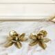 Pair of brass flower candle holders