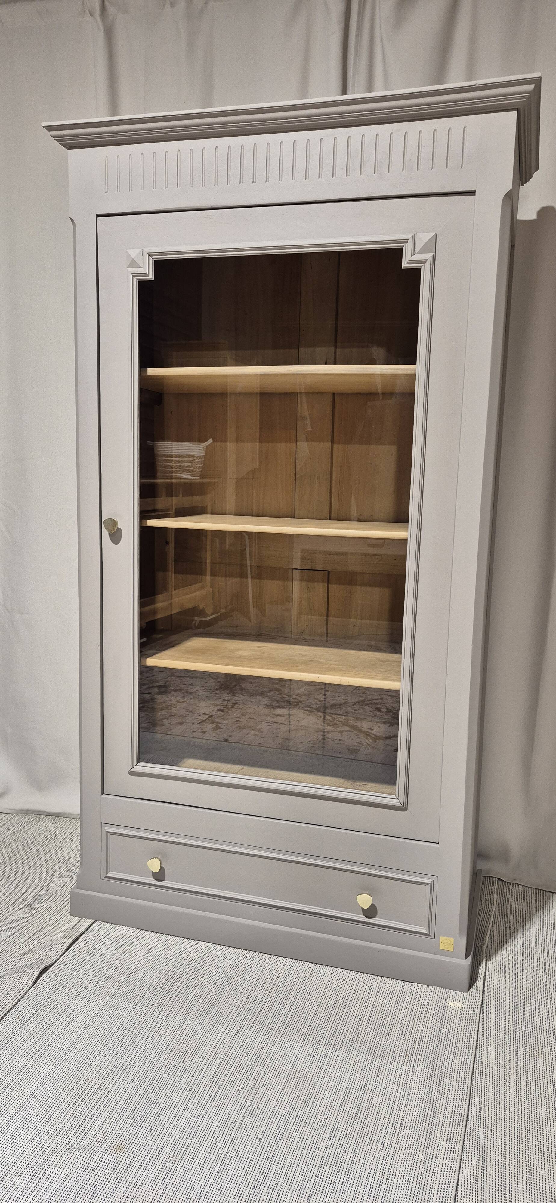 Glass display cabinet with drawer