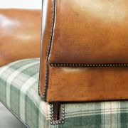 Antique daybed reupholstered with sheepskin and Scottish tartan wool