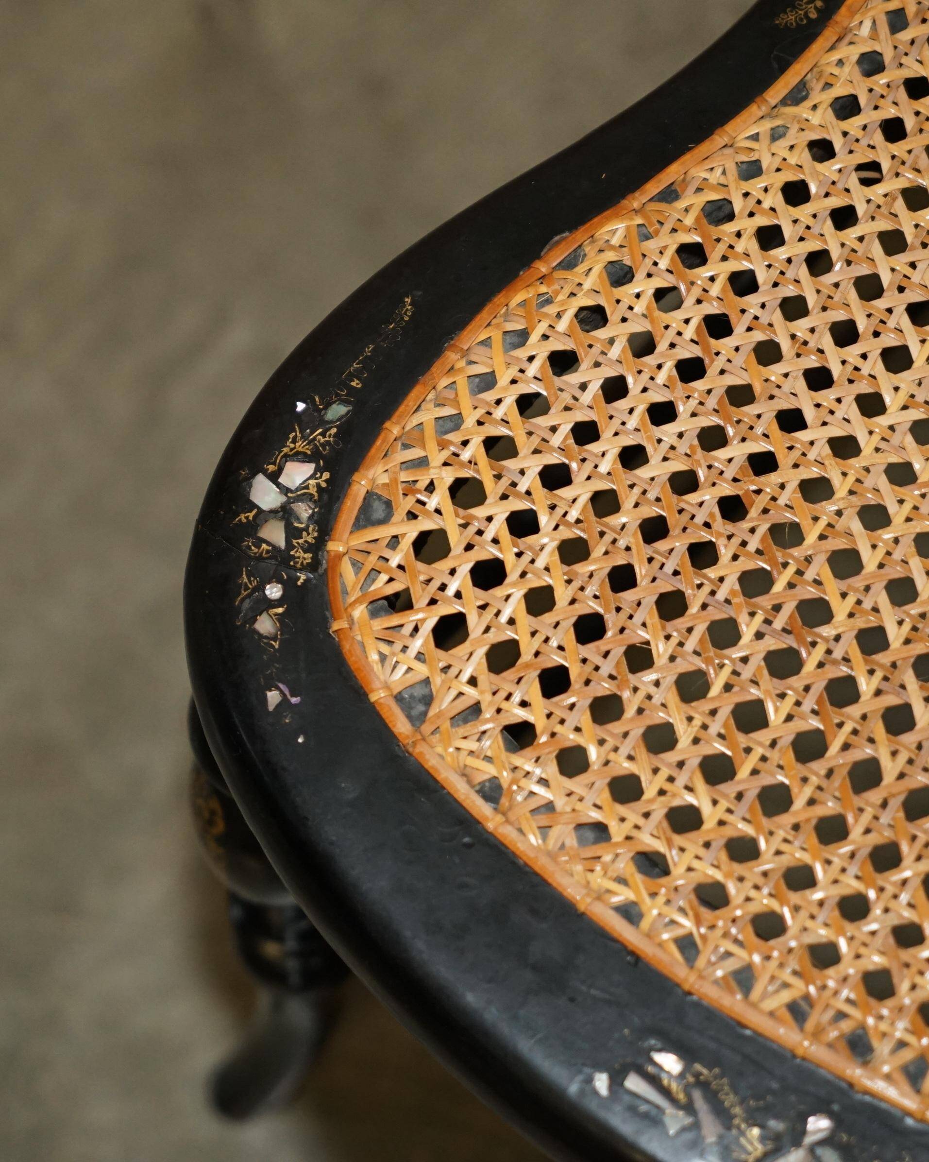 Four antique Regency bergère chairs with mother-of-pearl inlay.